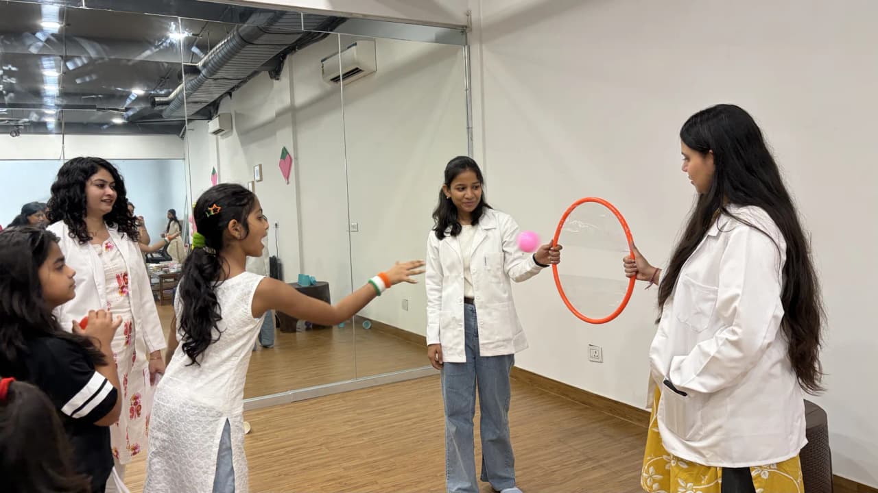 Children and therapists together at a Devine group session