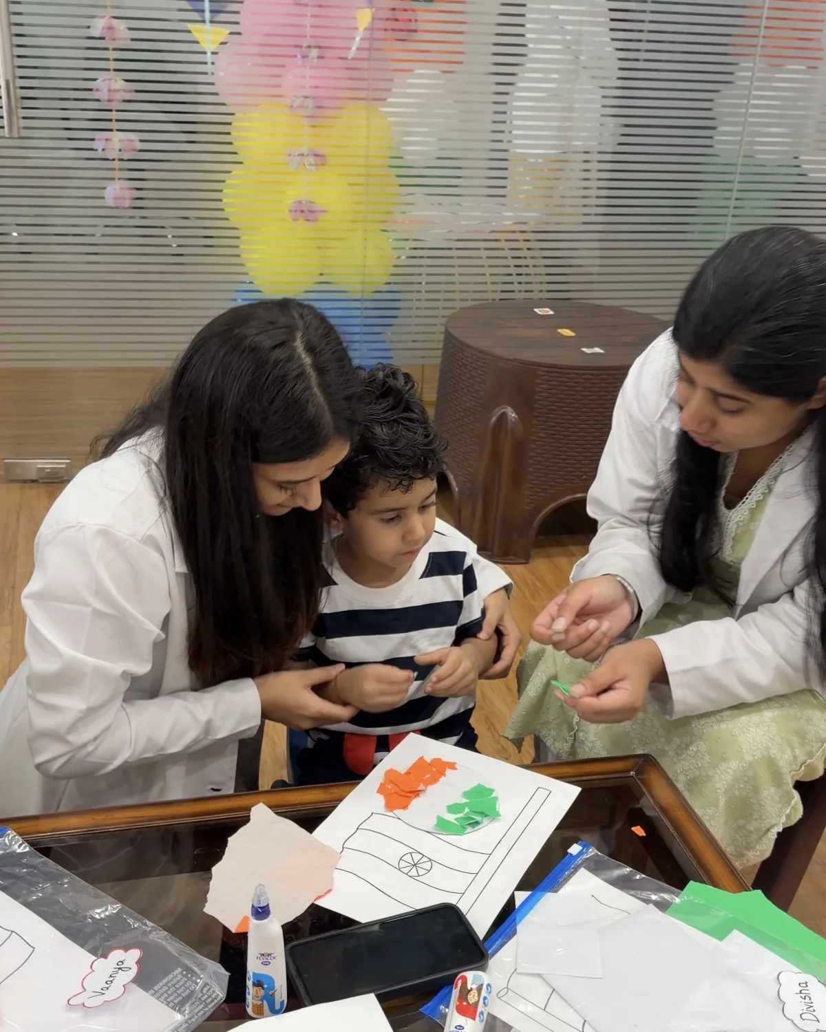 Two therapists working one-to-one with a child