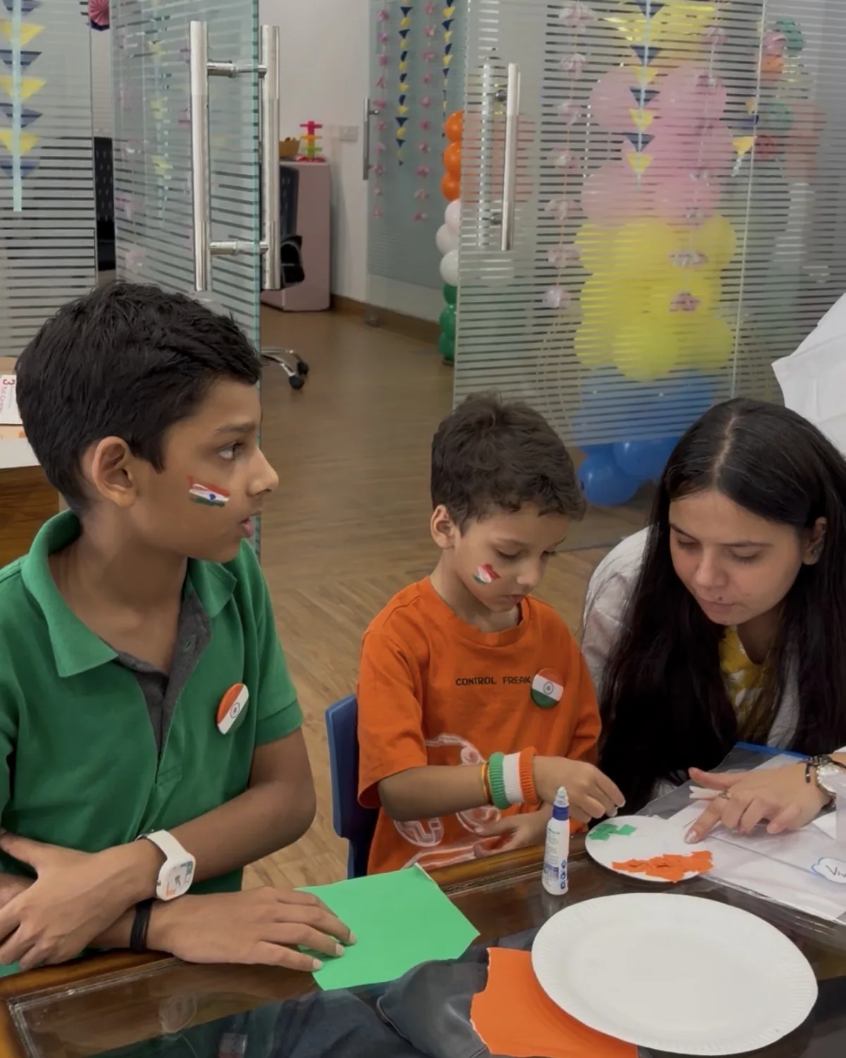 Children working on a table activity with a therapist