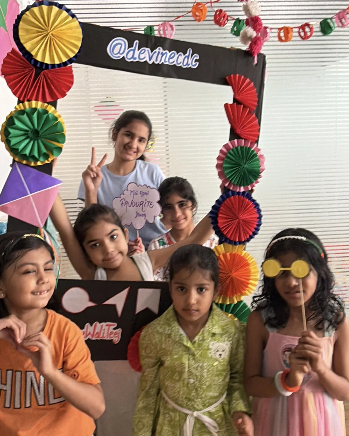 Children smiling together at a Devine celebration