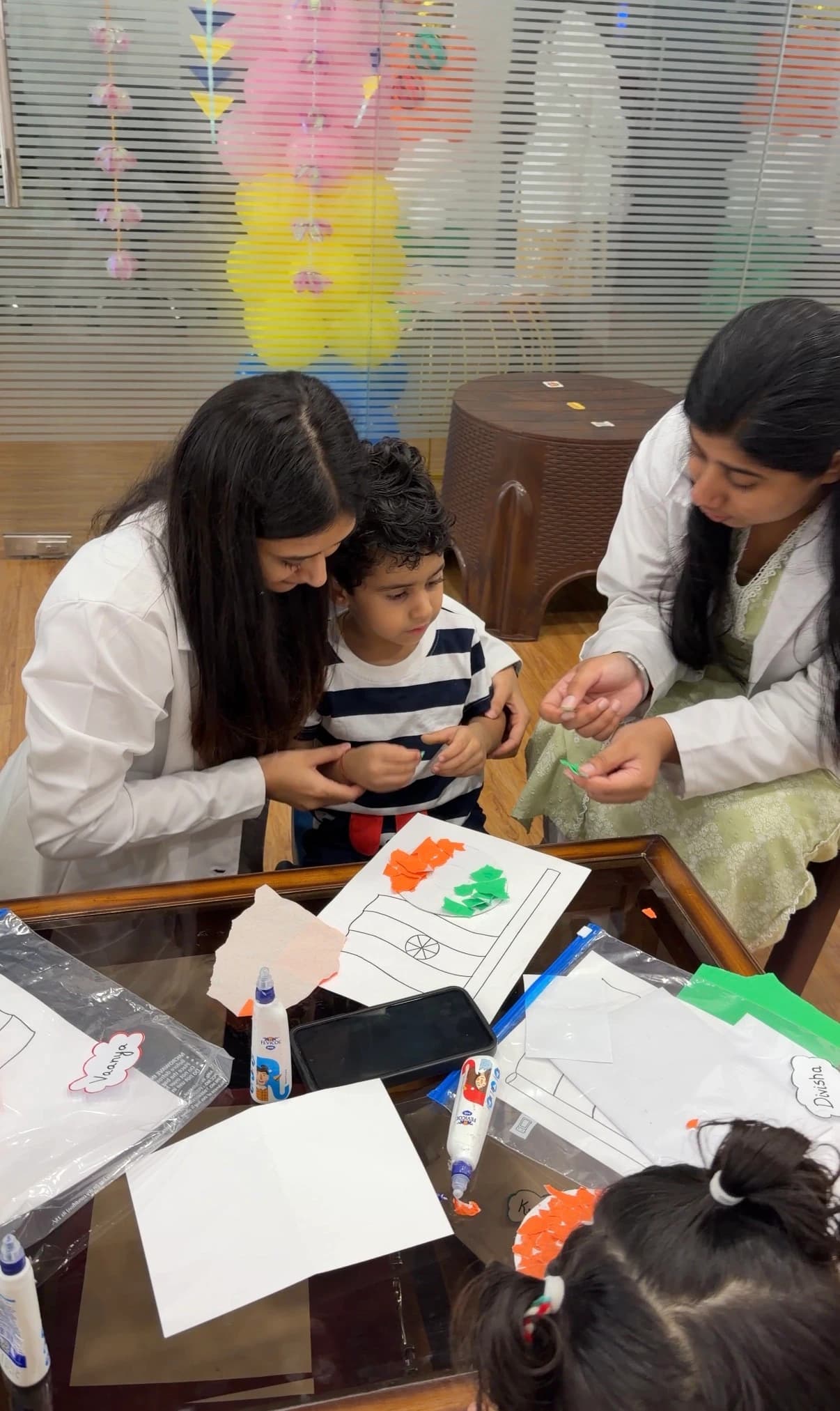 Devine therapists guiding a child during a structured ABA session